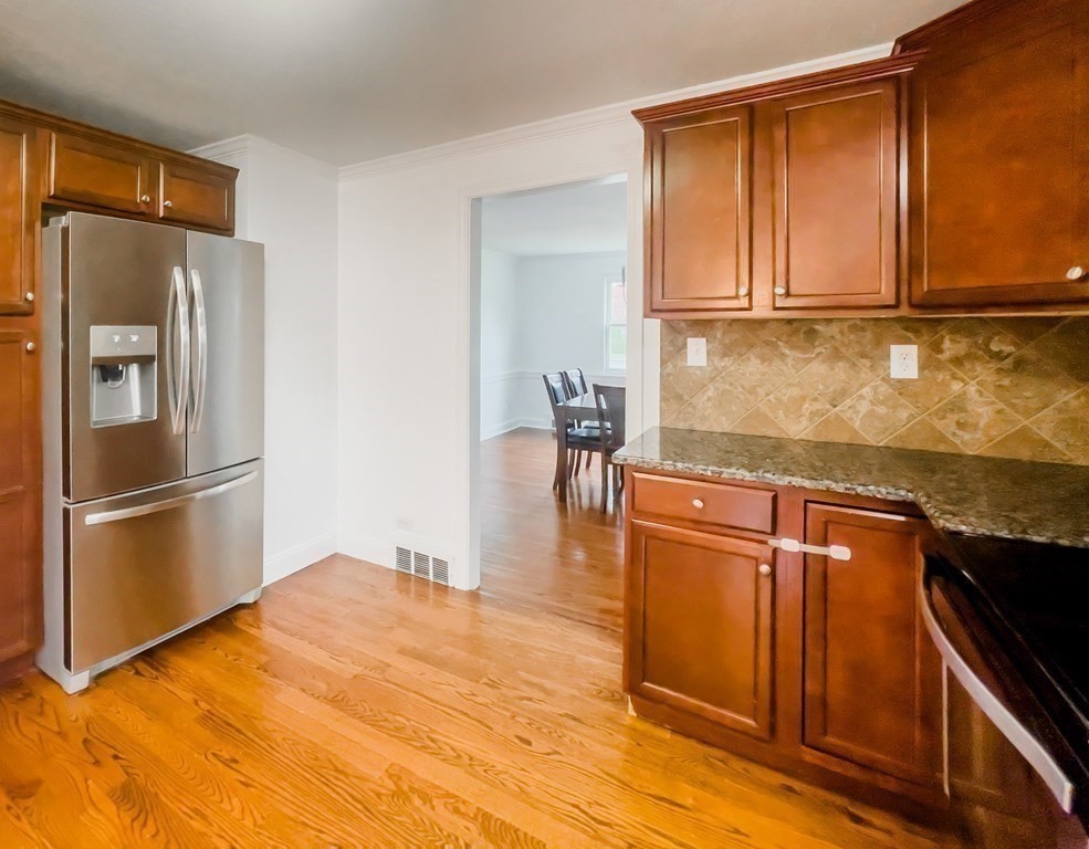 2072 Wilbraham Road Springfield, MA 01129 - Photo 8 of 22 a kitchen with stainless steel appliances granite countertop a refrigerator and a sink