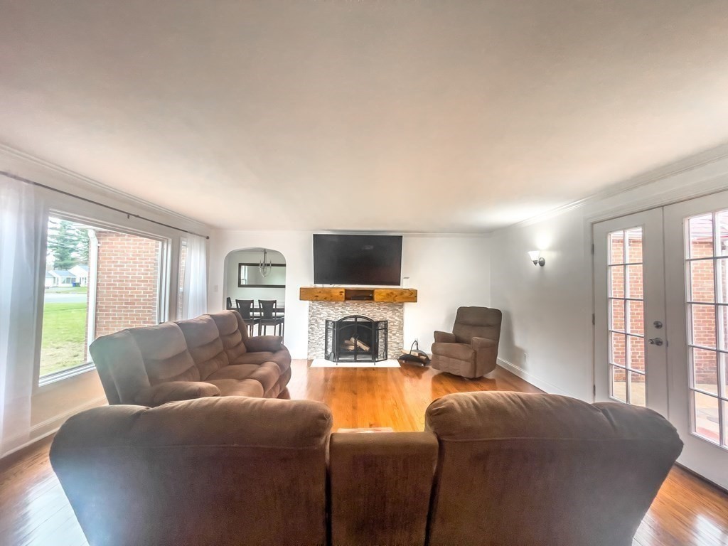 2072 Wilbraham Road Springfield, MA 01129 - Photo 10 of 22 a living room with furniture a flat screen tv and a fireplace