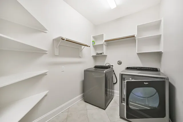 a view of a kitchen with a sink and a large window