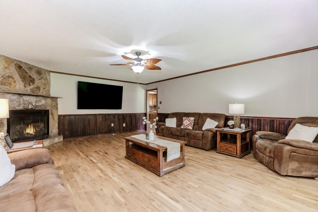 750 Jett Roberts Road Jefferson, GA 30549 - Photo 12 of 37 a living room with furniture fireplace and flat screen tv