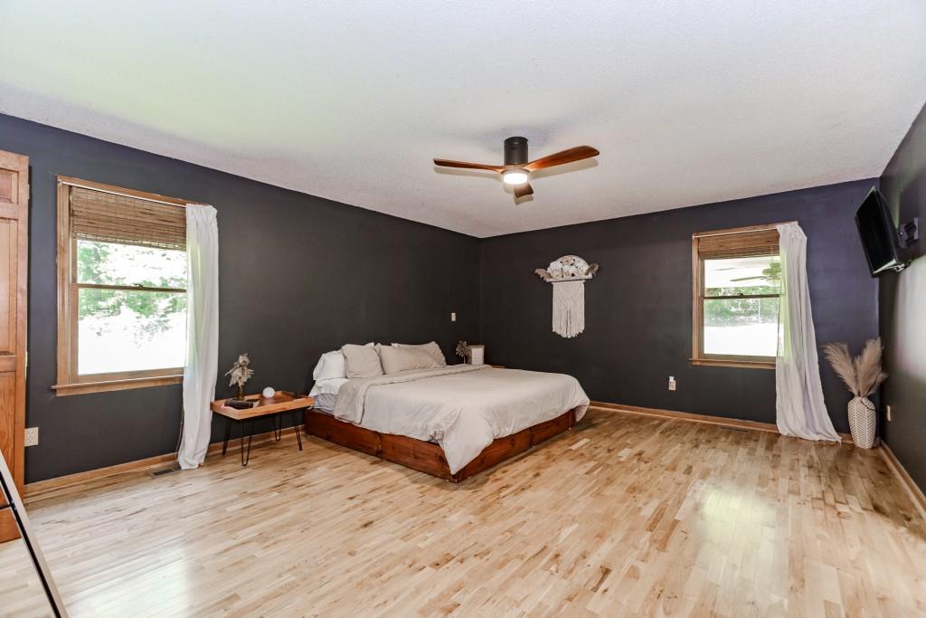 750 Jett Roberts Road Jefferson, GA 30549 - Photo 13 of 37 a bedroom with a bed and a flat screen tv