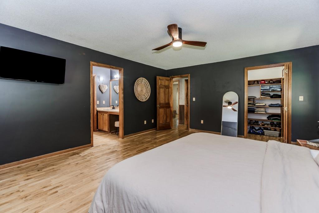 750 Jett Roberts Road Jefferson, GA 30549 - Photo 14 of 37 a bedroom with a bed and a flat screen tv