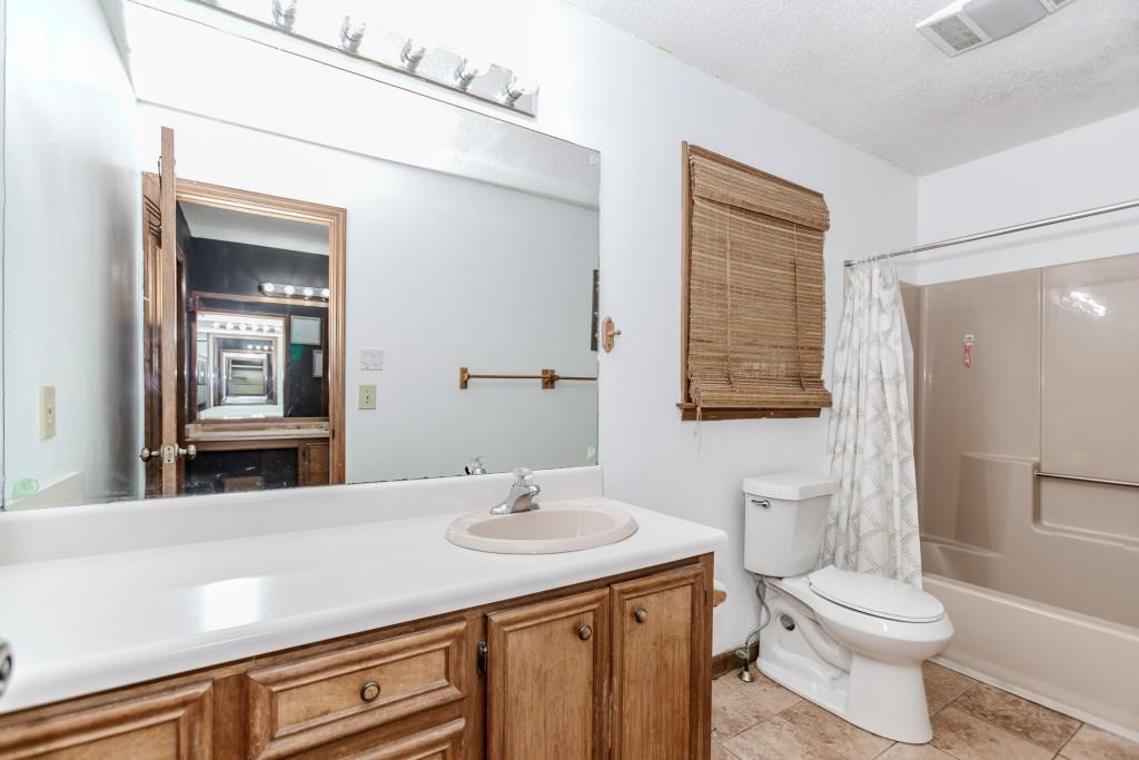 750 Jett Roberts Road Jefferson, GA 30549 - Photo 18 of 37 a bathroom with a sink toilet and shower