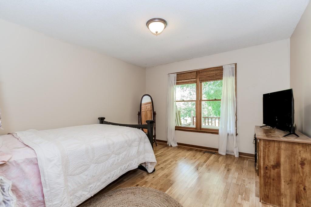 750 Jett Roberts Road Jefferson, GA 30549 - Photo 22 of 37 a bedroom with a bed and a flat screen tv