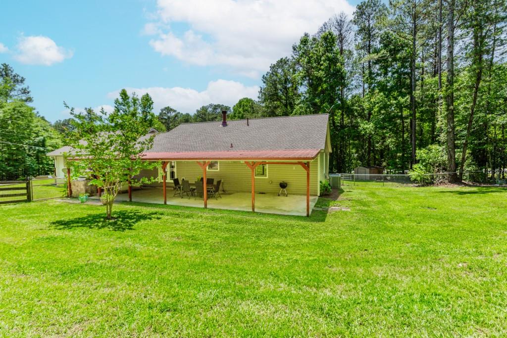 750 Jett Roberts Road Jefferson, GA 30549 - Photo 26 of 37 a view of a house with a backyard