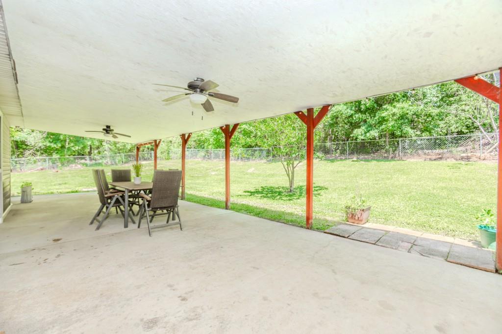 750 Jett Roberts Road Jefferson, GA 30549 - Photo 31 of 37 a view of a patio with a table chairs and garden