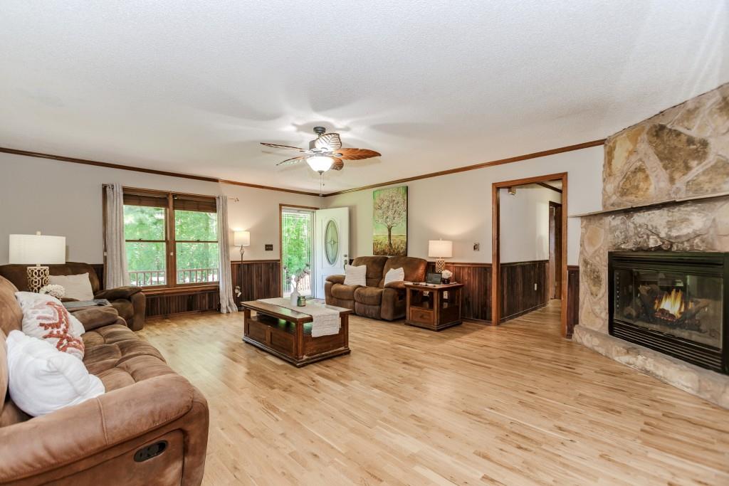 750 Jett Roberts Road Jefferson, GA 30549 - Photo 10 of 37 a living room with furniture fireplace and a large window