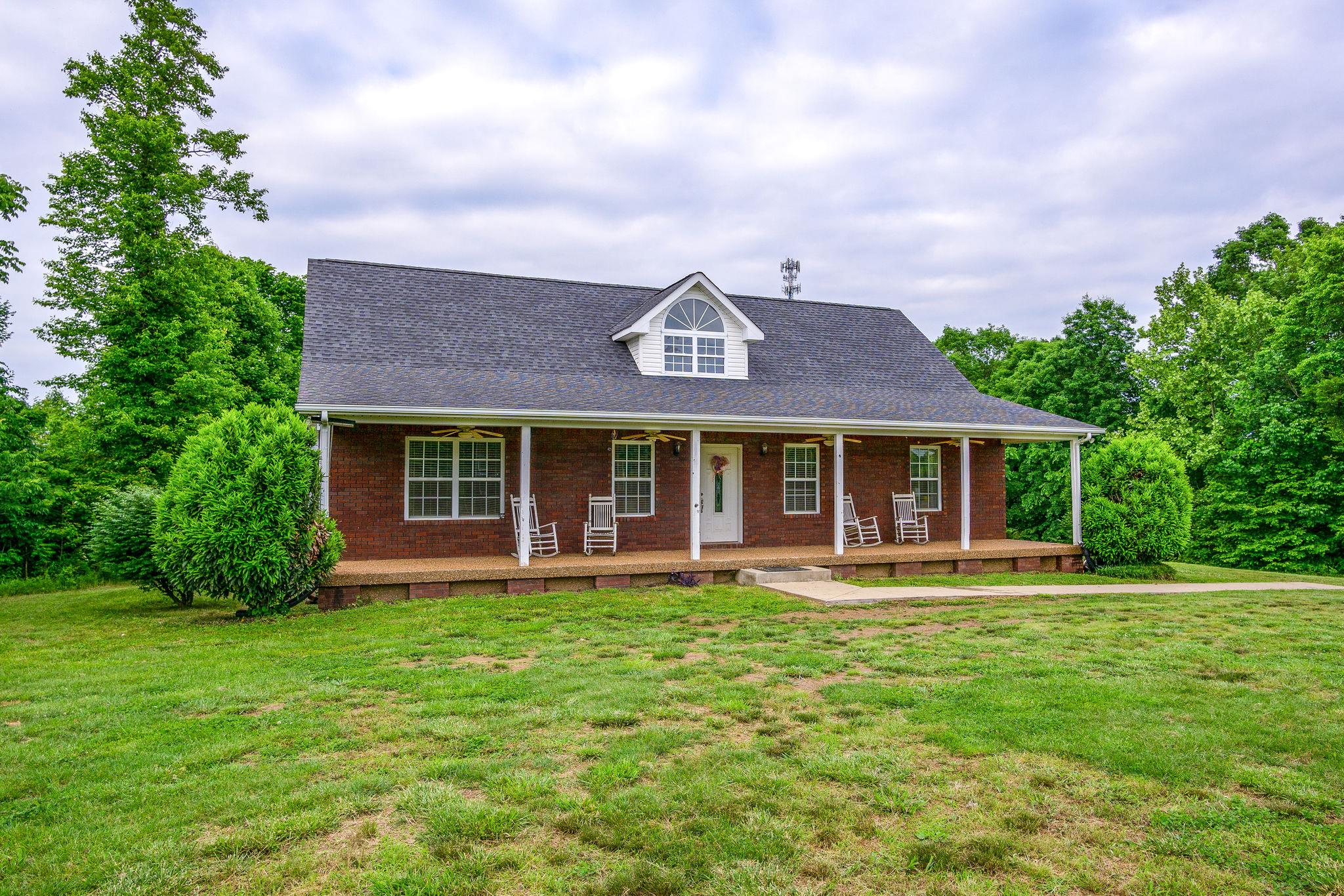 2208 Mt Pleasant Cemetery Road Primm Springs, TN 38476 - Photo 1 of 21 front view of a house with a yard