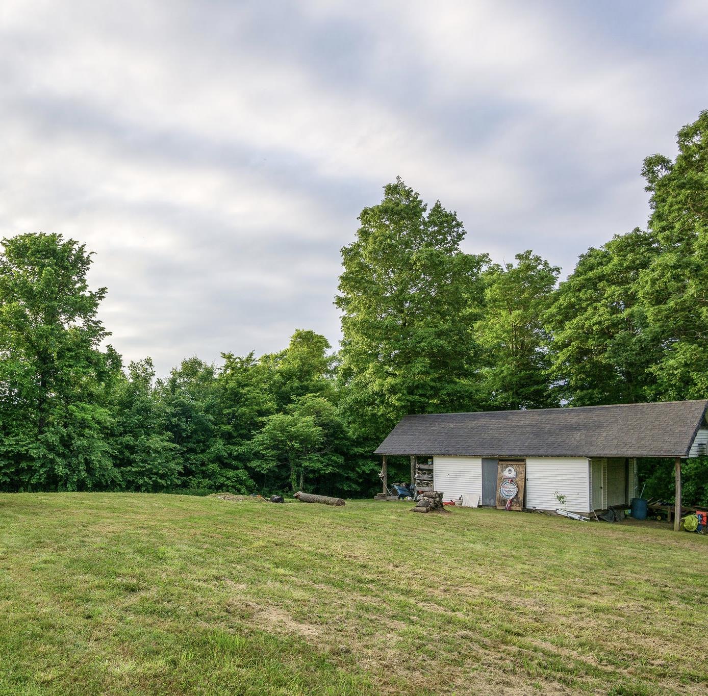 2208 Mt Pleasant Cemetery Road Primm Springs, TN 38476 - Photo 5 of 21 a house with a yard