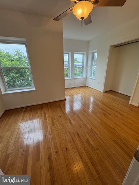 1767 E Street Northeast Washington, DC 20002 - Photo 4 of 8 wooden floor in an empty room with a window