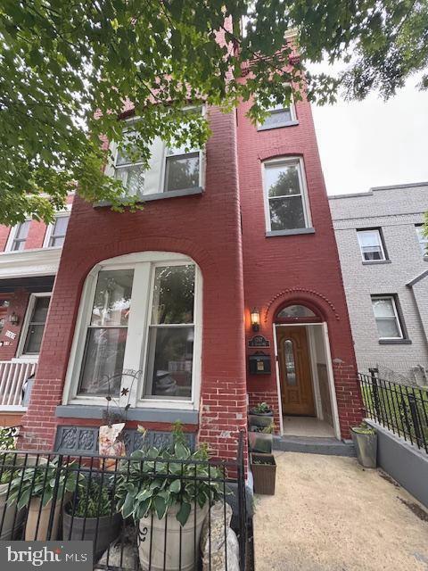 1767 E Street Northeast Washington, DC 20002 - Photo 6 of 8 a front view of a multi story residential apartment building