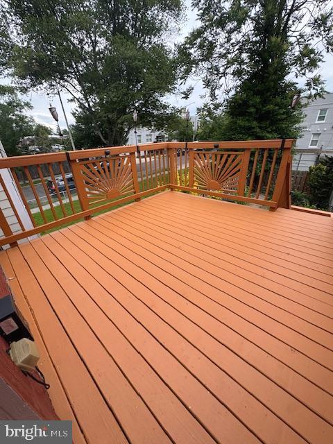 1767 E Street Northeast Washington, DC 20002 - Photo 7 of 8 a terrace view with wooden floor and large trees