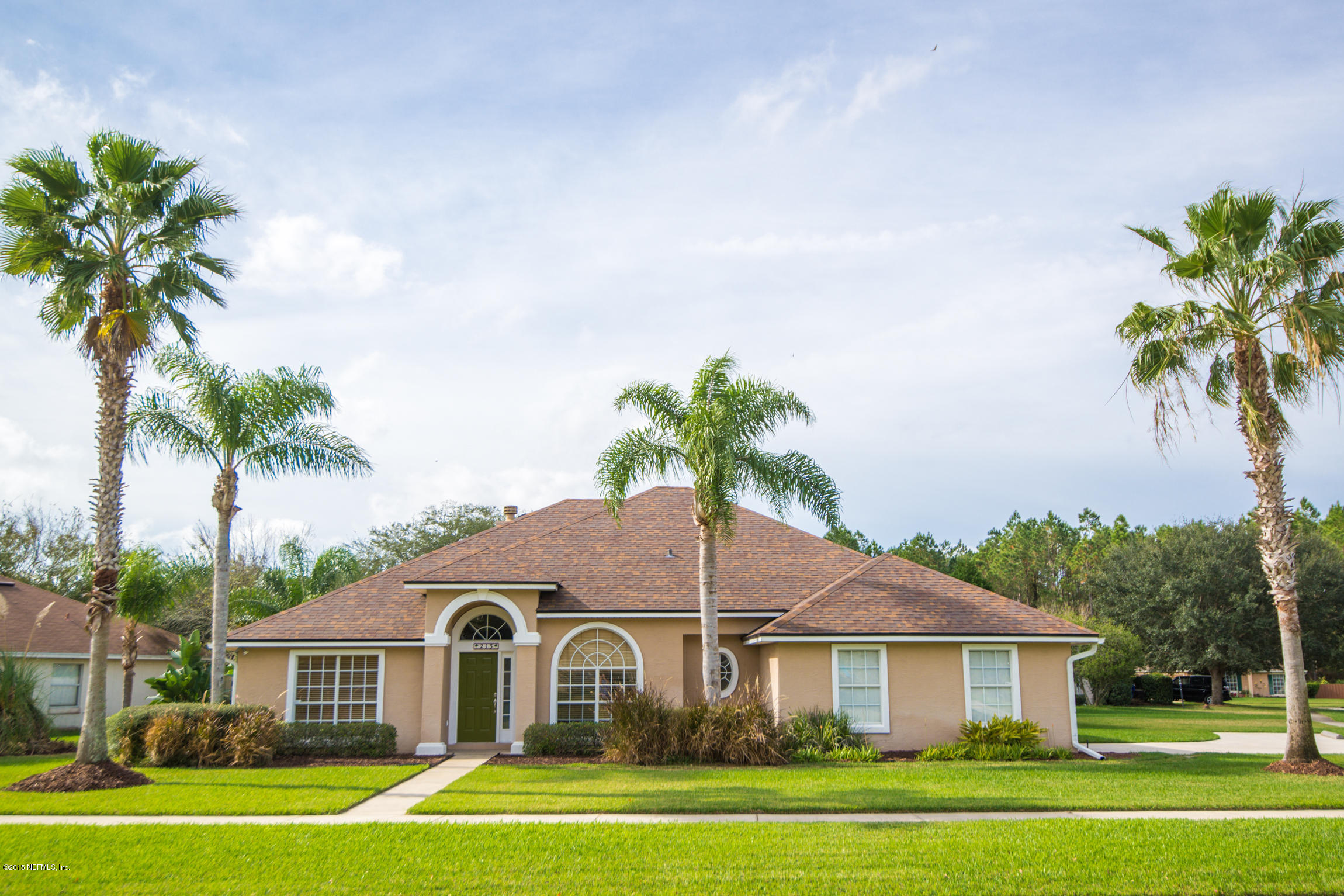 213 Merida Road St. Augustine, FL 32086 - Photo 1 of 34 a front view of a house with a garden
