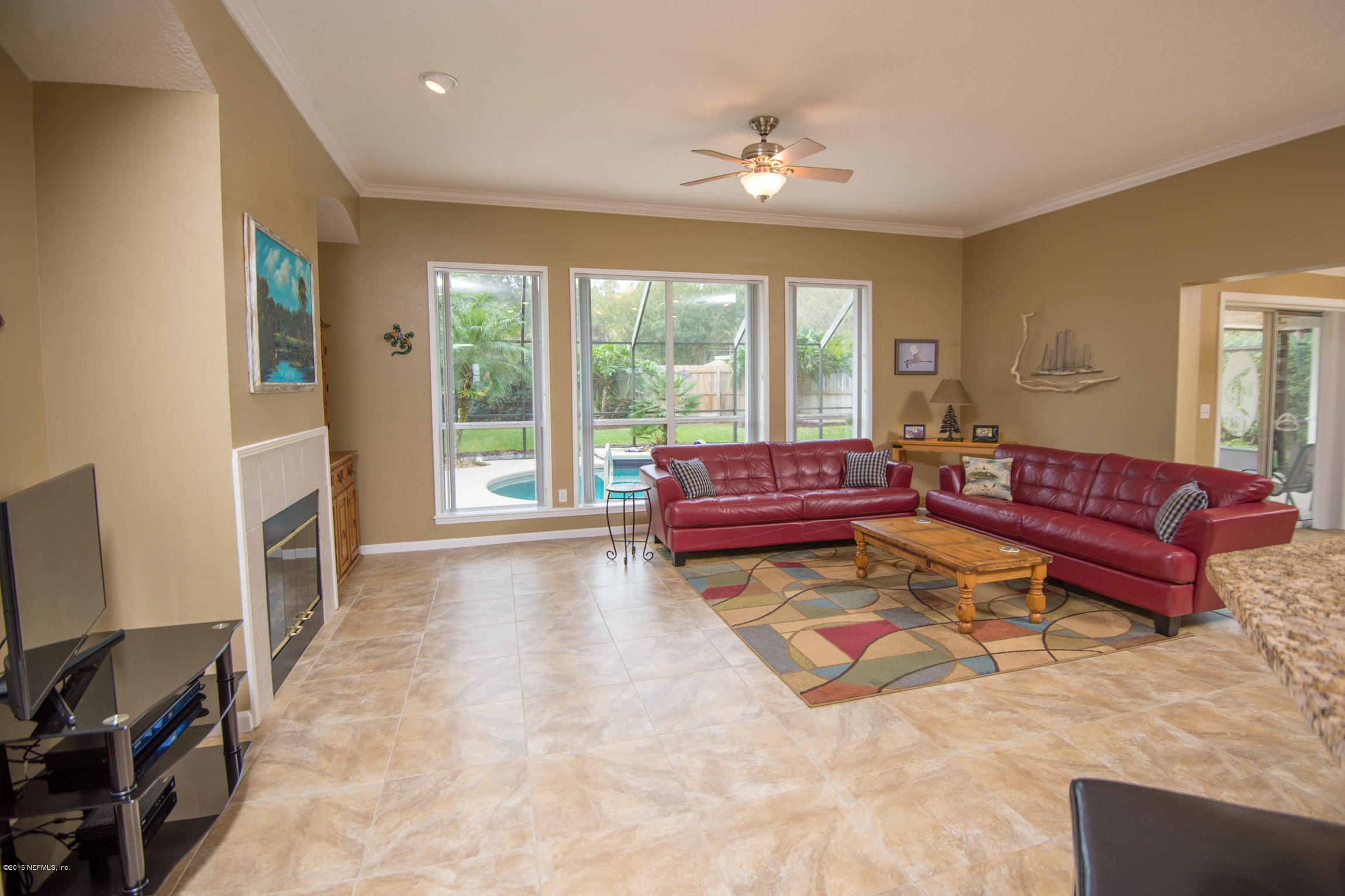 213 Merida Road St. Augustine, FL 32086 - Photo 12 of 34 a living room with furniture and a flat screen tv