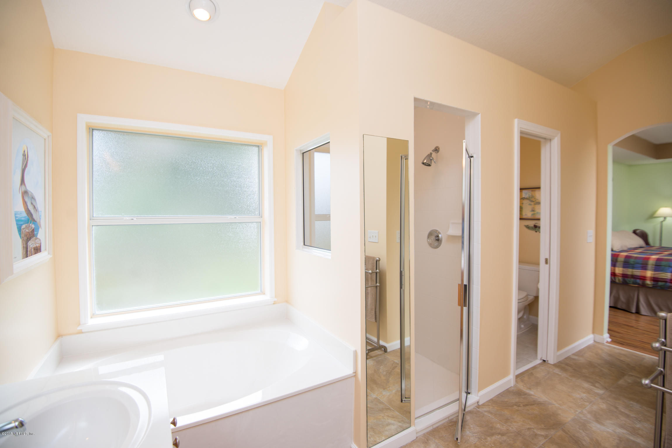 213 Merida Road St. Augustine, FL 32086 - Photo 20 of 34 a bathroom with a shower and a tub