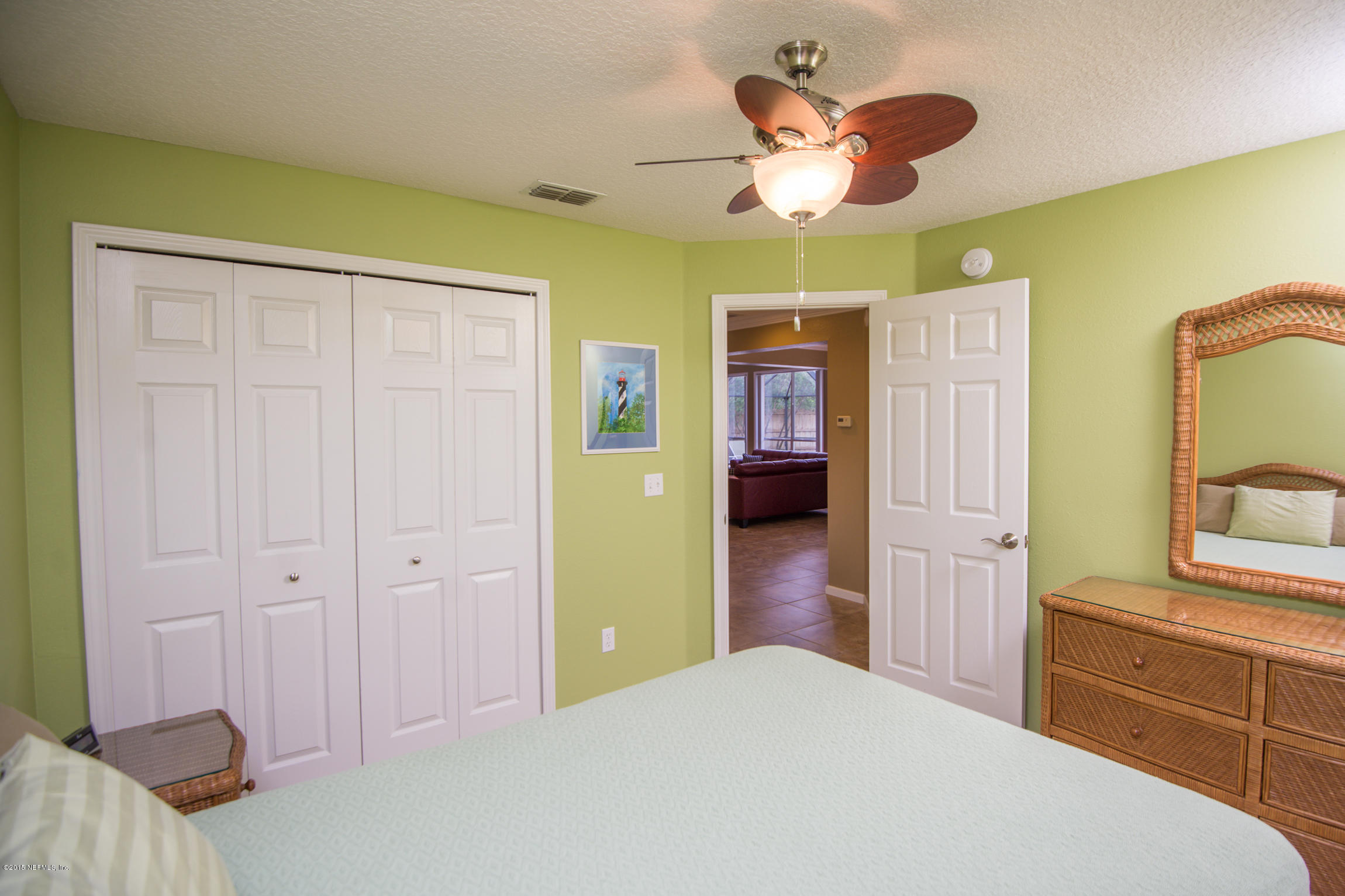 213 Merida Road St. Augustine, FL 32086 - Photo 21 of 34 a bedroom with a bed and a dresser