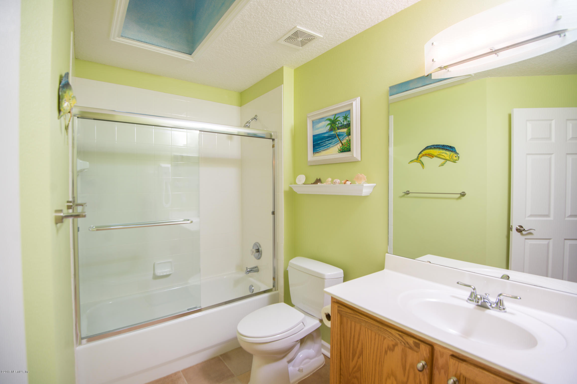 213 Merida Road St. Augustine, FL 32086 - Photo 23 of 34 a bathroom with a sink and a mirror