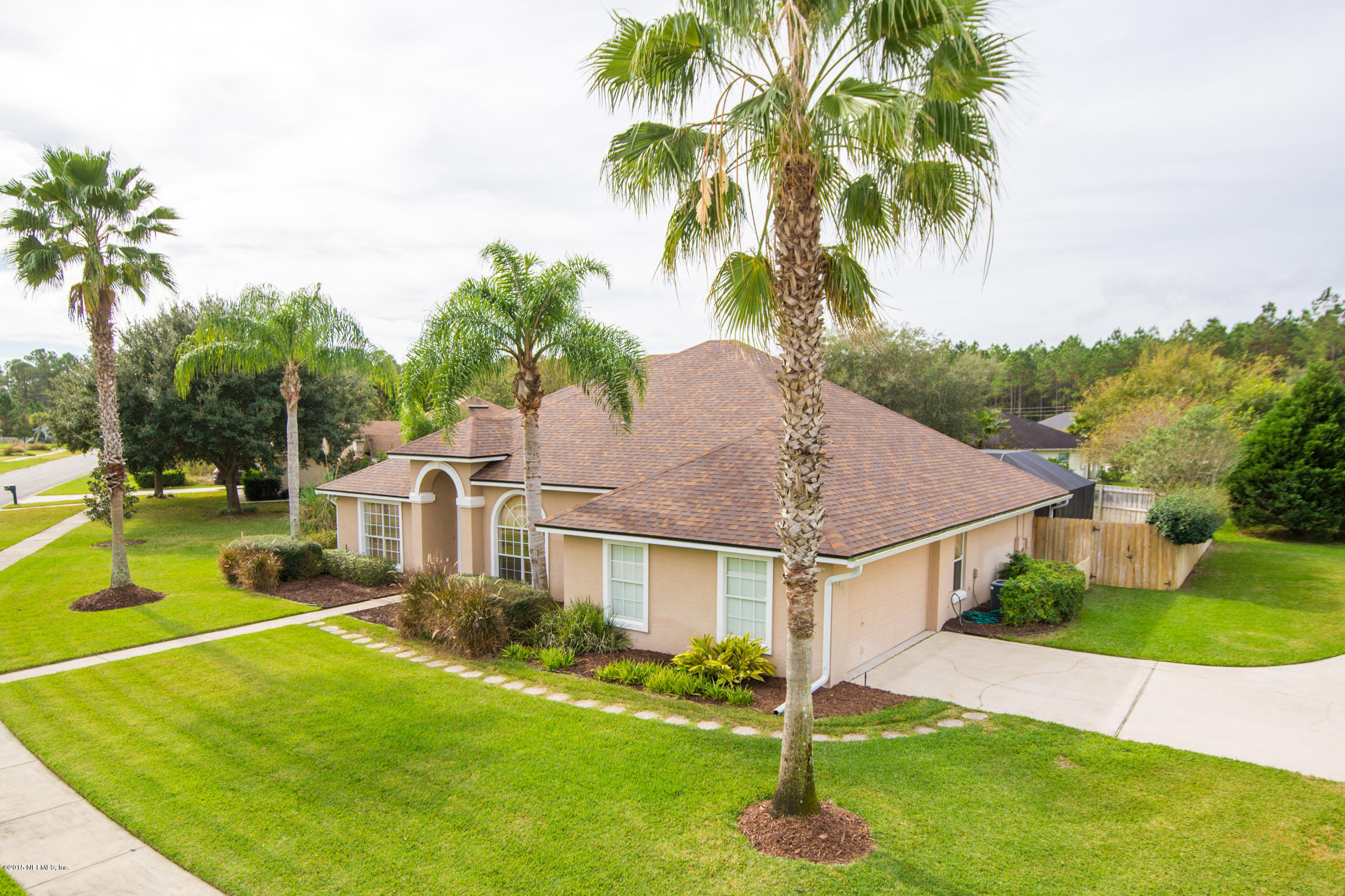 213 Merida Road St. Augustine, FL 32086 - Photo 26 of 34 a view of a house with swimming pool and a yard
