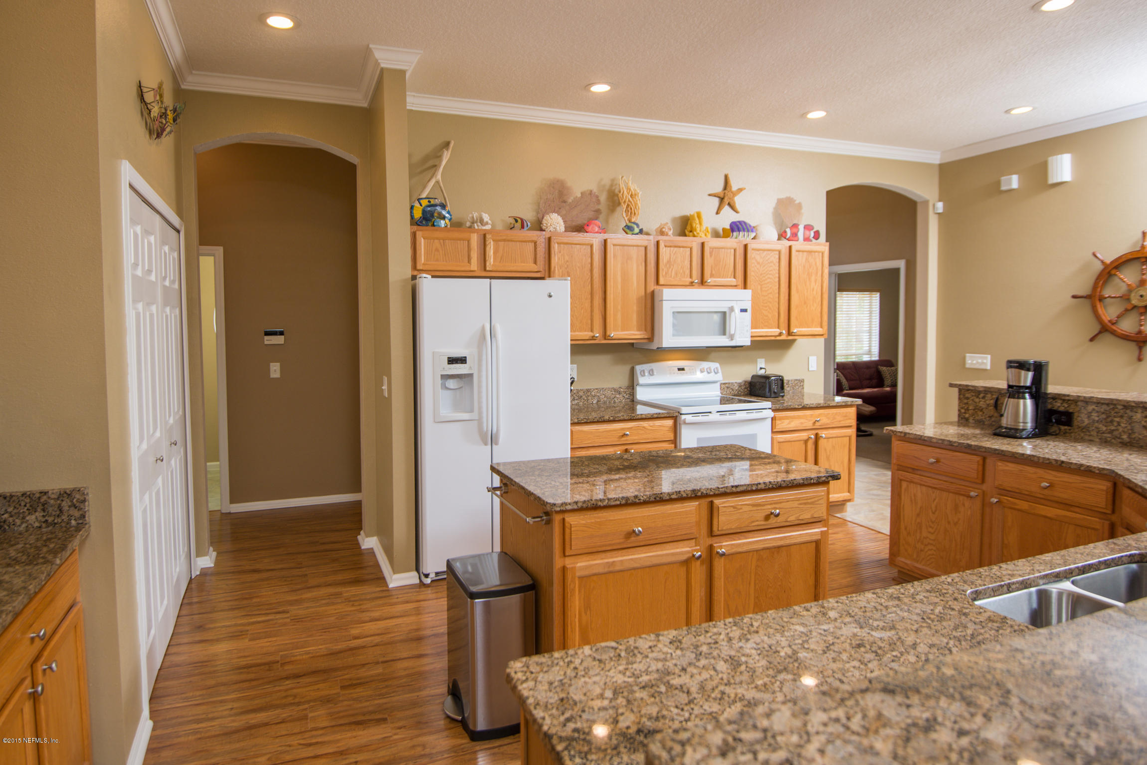 213 Merida Road St. Augustine, FL 32086 - Photo 10 of 34 a kitchen with stainless steel appliances granite countertop a sink and cabinets