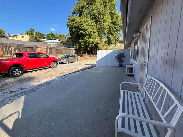 a view of a backyard with a sitting area