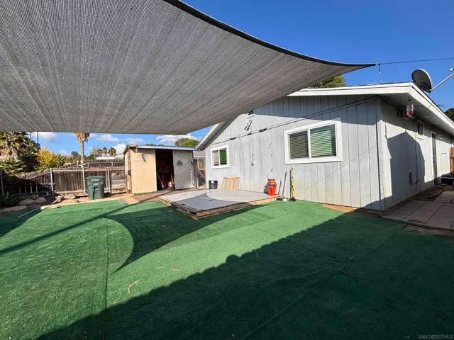 a view of a backyard of the house
