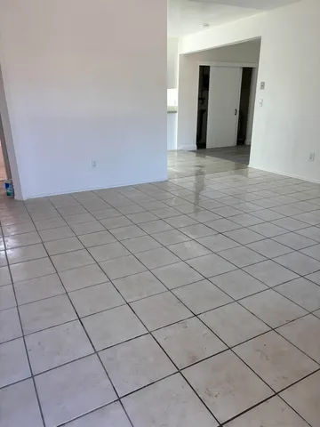 a view of an empty room and window