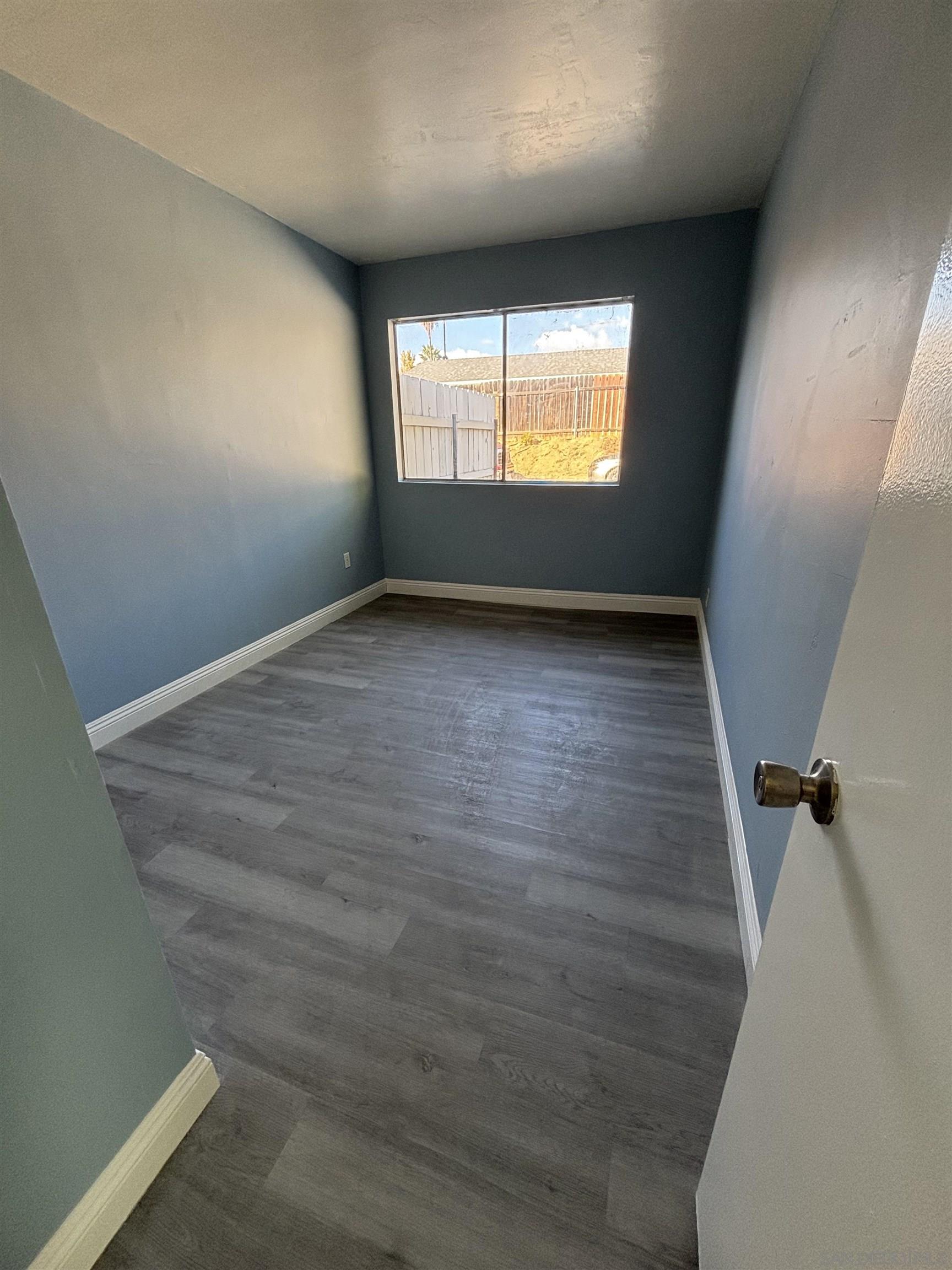 8209 Jema Way Lakeside, CA 92040 - Photo 22 of 40 wooden floor in an empty room with a window