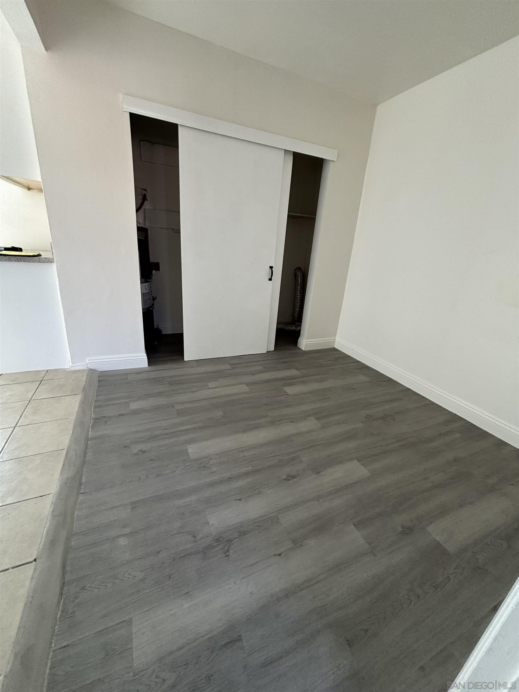 8209 Jema Way Lakeside, CA 92040 - Photo 24 of 40 a view of an empty room with wooden floor