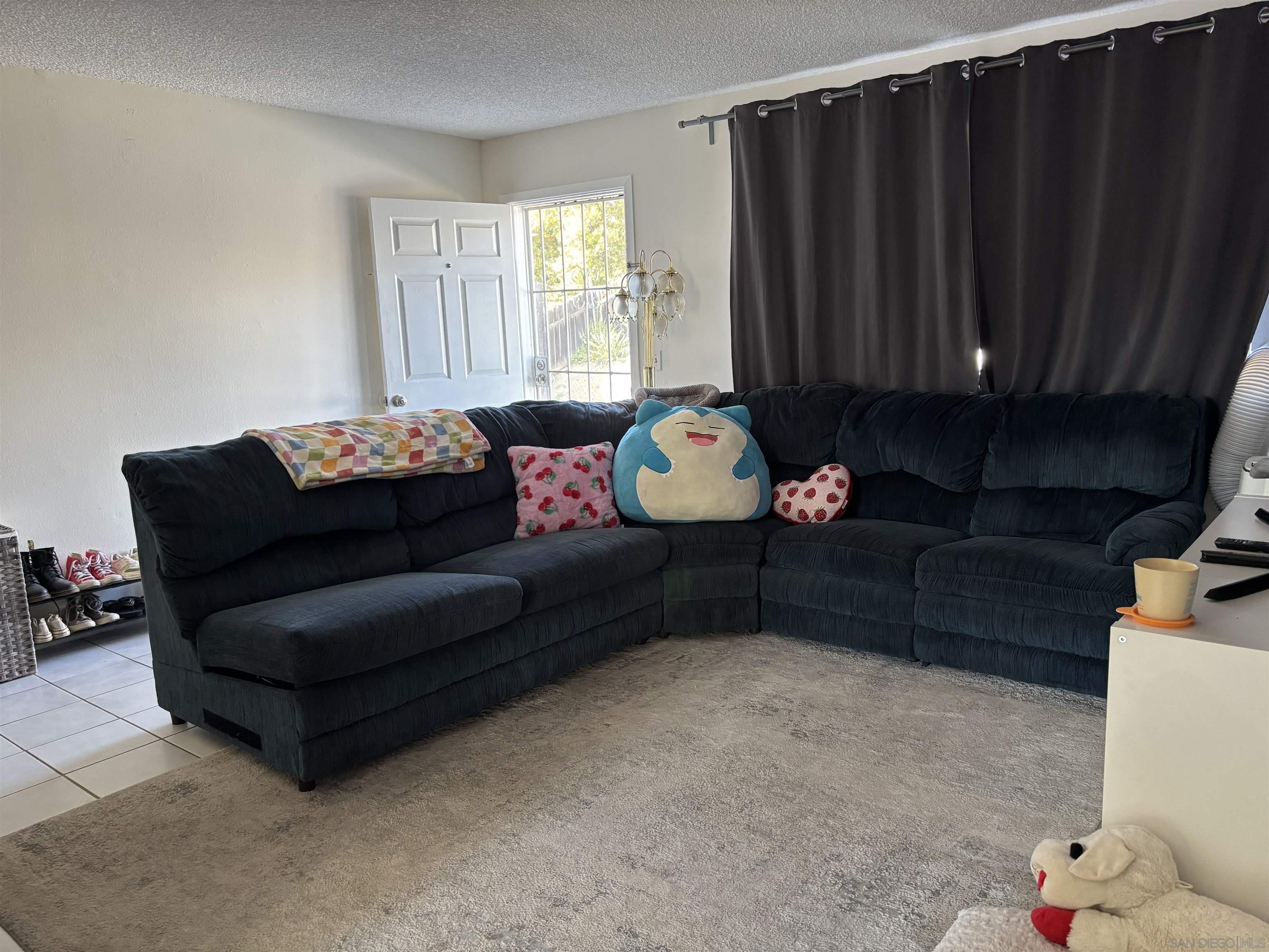 8209 Jema Way Lakeside, CA 92040 - Photo 33 of 40 a living room with furniture and a window