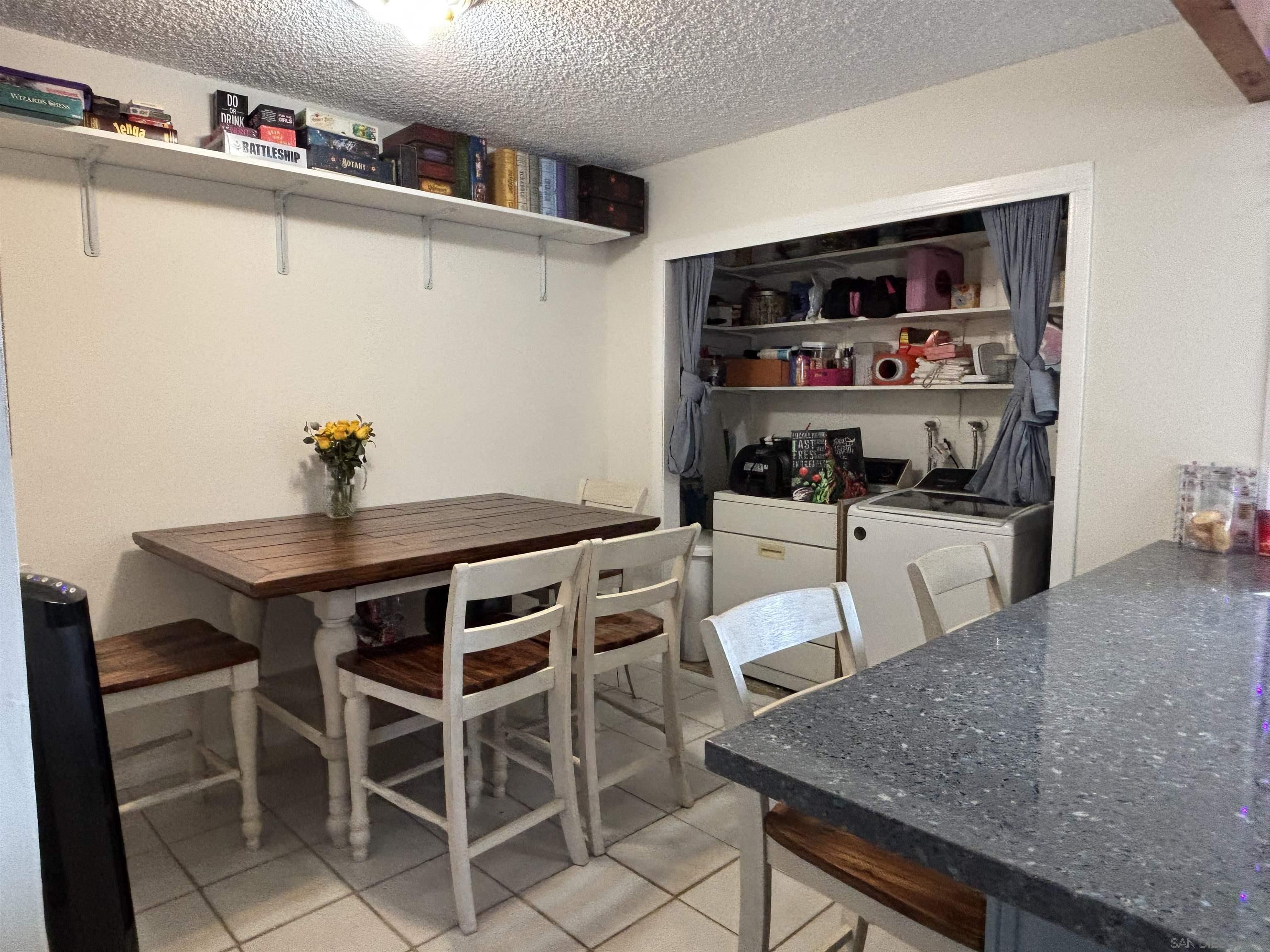 8209 Jema Way Lakeside, CA 92040 - Photo 34 of 40 a view of a dining room with furniture and a kitchen