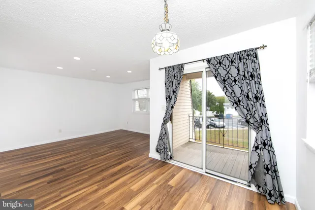 a view of kitchen with wooden floor
