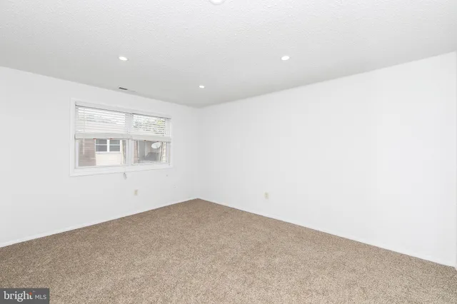 a bathroom with a toilet and bathtub