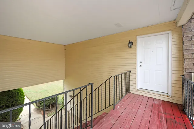 a view of a balcony with furniture