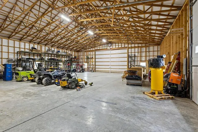 a large white kitchen with a large window