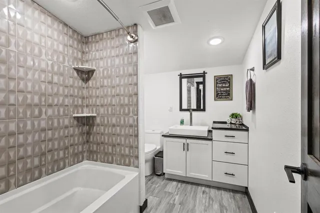 a bedroom with a baby bed and a dresser