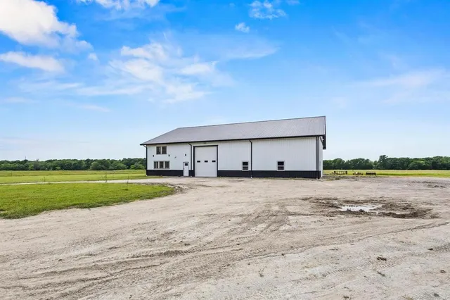 a view of a field with an ocean