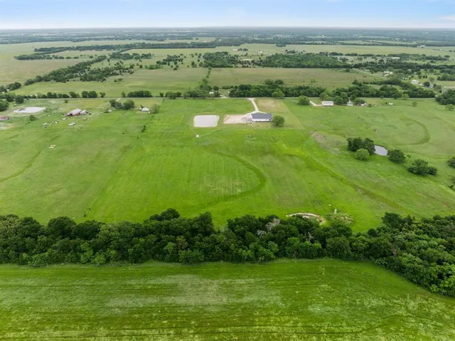 a view of a yard with an ocean view