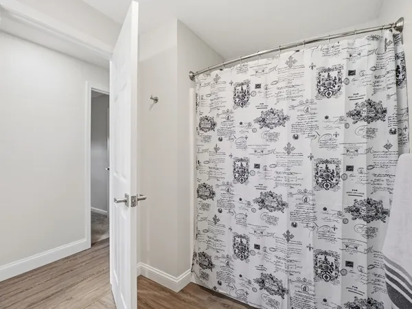 a bathroom with a shower curtain