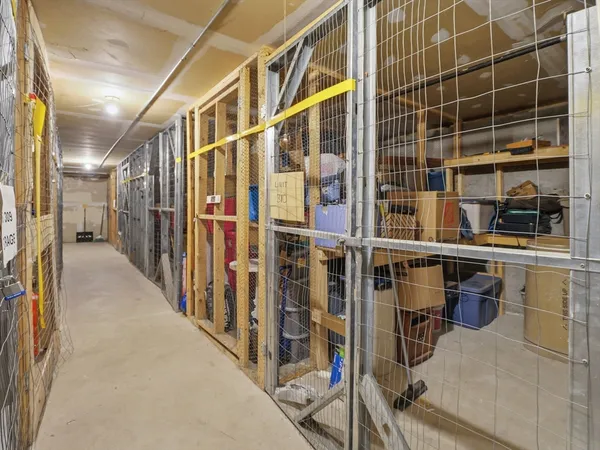 a view of a big room with entryway wooden floor and windows