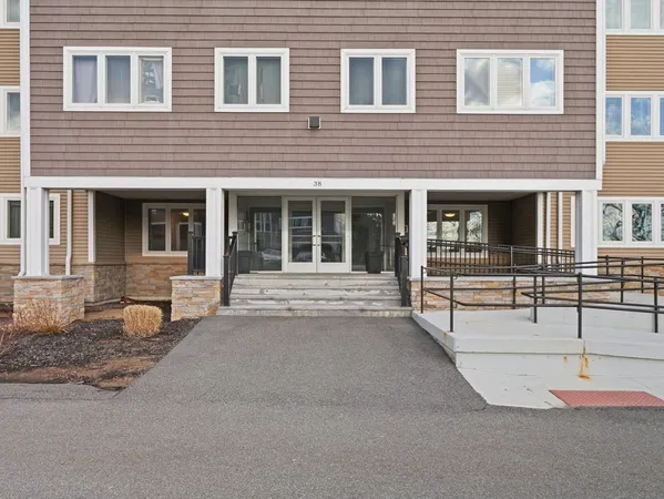 a view of a brick wall in front of a building