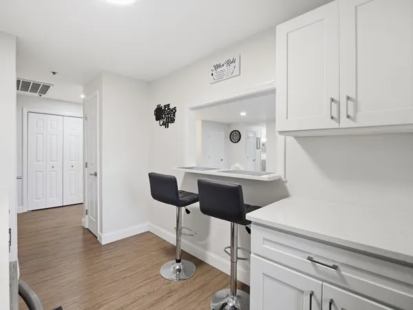 a workspace with furniture and wooden floor