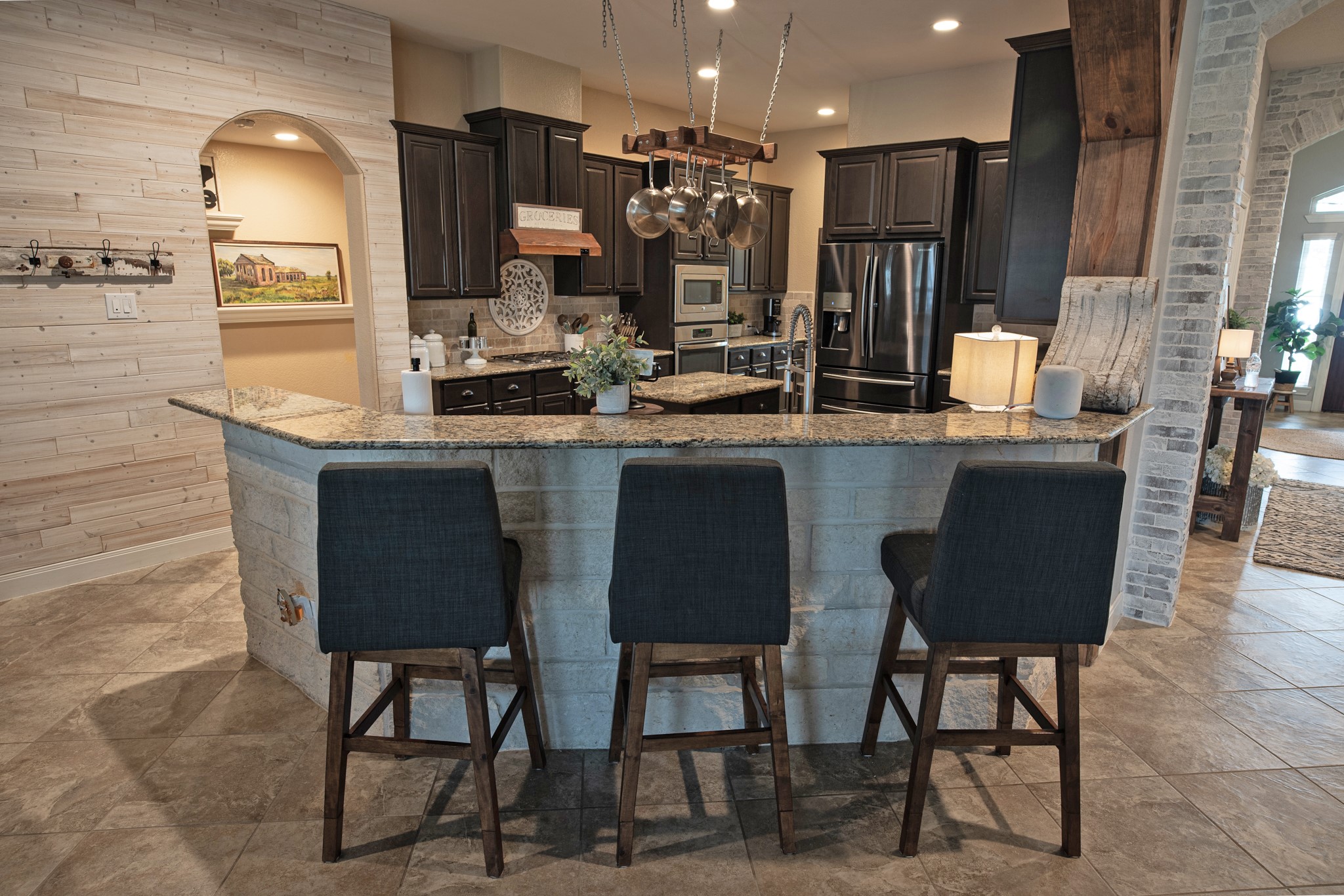 1283 Laurel Lane Angleton, TX 77515 - Photo 12 of 40 Kitchen Bar Features Limestone around the counter bar.