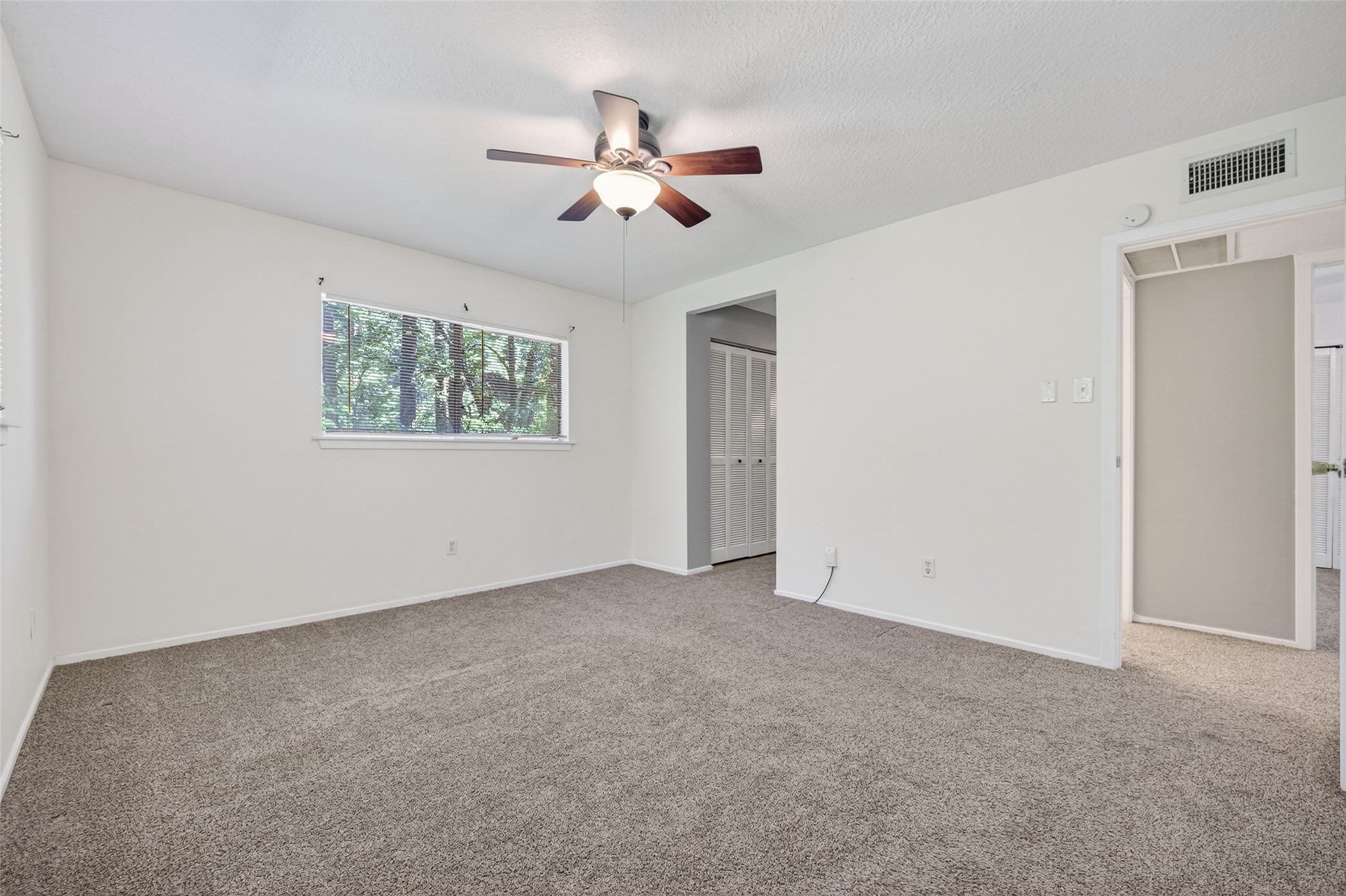 1106 East Red Cedar Circle Spring, TX 77380 - Photo 32 of 43 a view of an empty room with a window