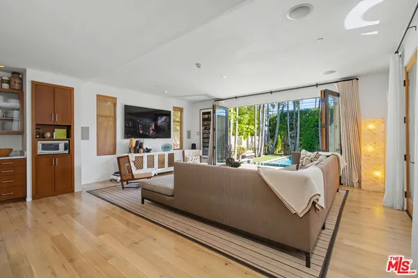 a kitchen with stainless steel appliances granite countertop a large counter space and a large window