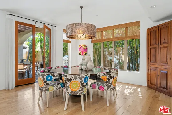 a living room with furniture a rug and a flat screen tv