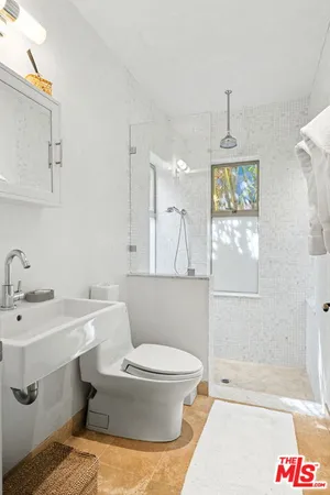 a utility room with sink dryer and washer