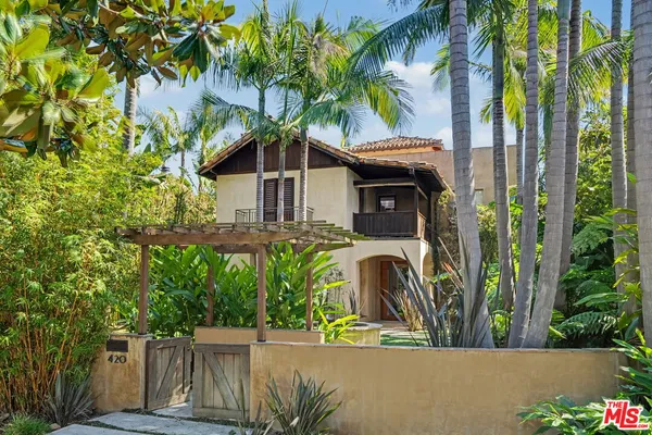 a view of a house with a tree