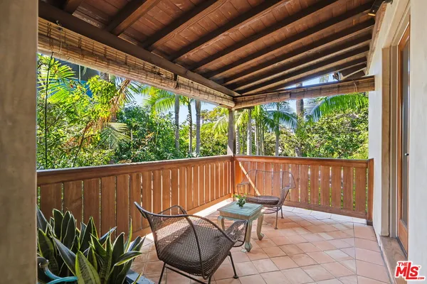 a view of balcony with yard