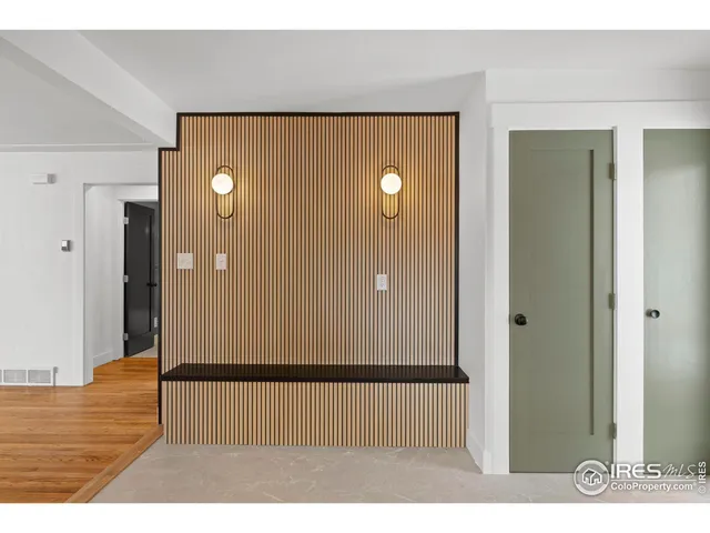 a view of a room with wooden floor