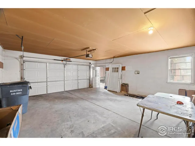 a view of a livingroom with furniture and garage
